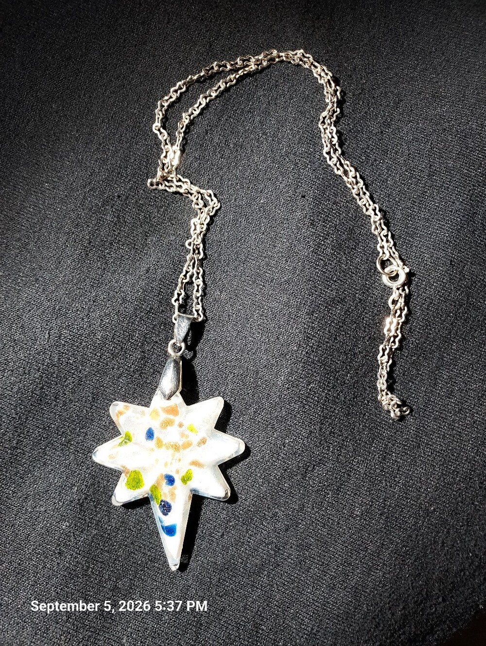 Silver Starburst Pendant Necklace with Blue and Green Accents